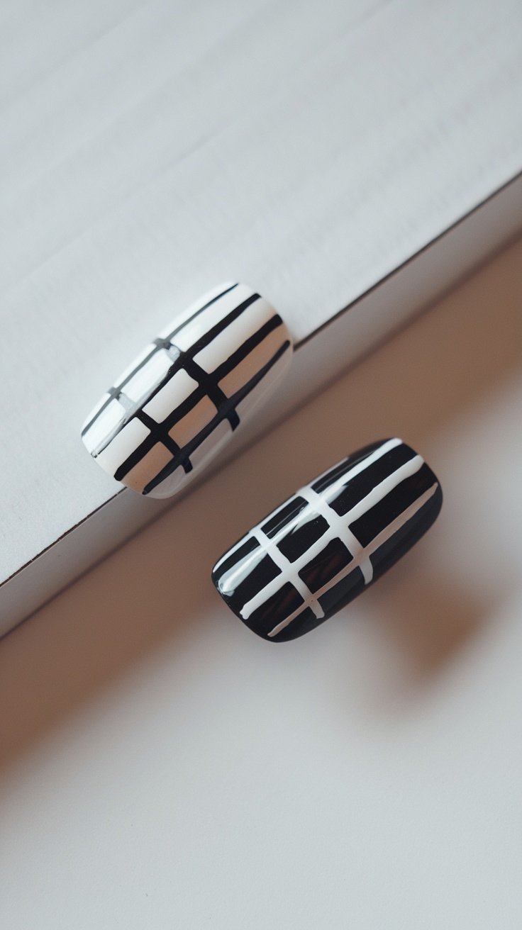 Two-tone nails featuring black and white designs on a light background.